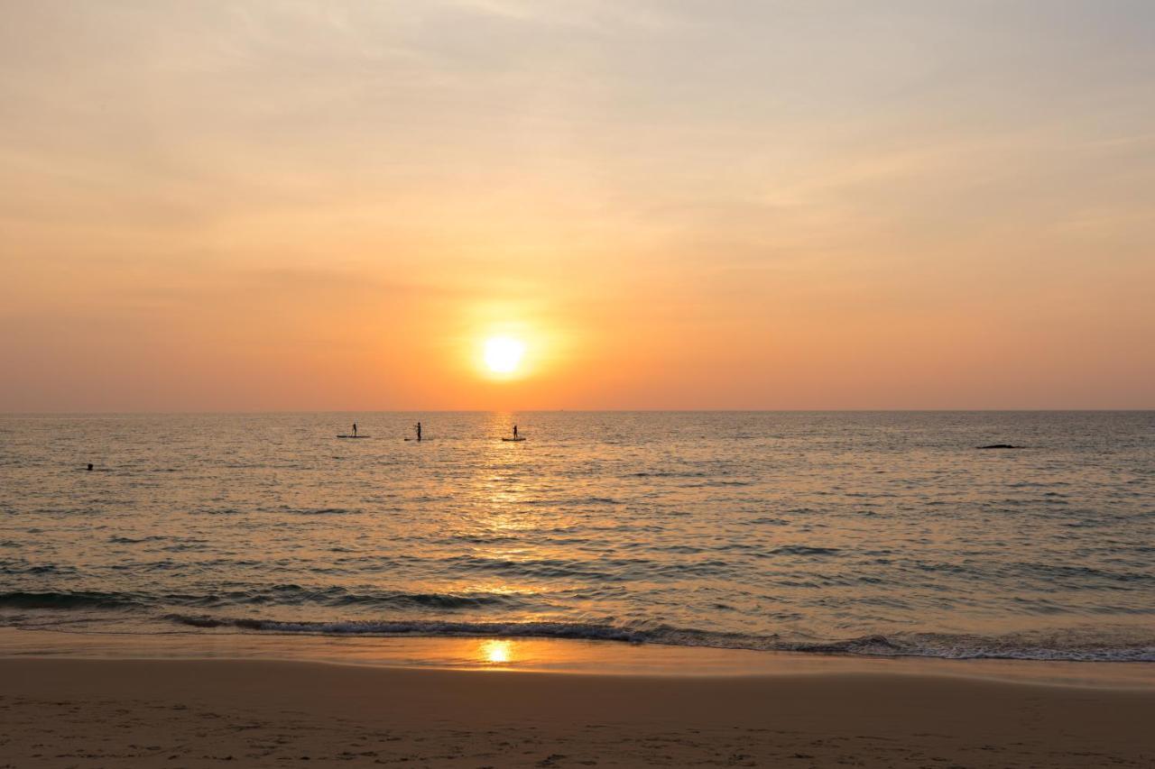 Outrigger Surin Beach Resort - Sha Extra Plus Exterior photo Sunset at the beach