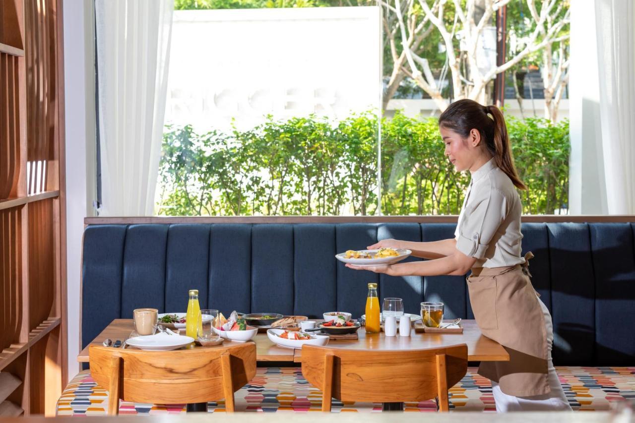 Outrigger Surin Beach Resort - Sha Extra Plus Exterior photo A Thai waitress serving food
