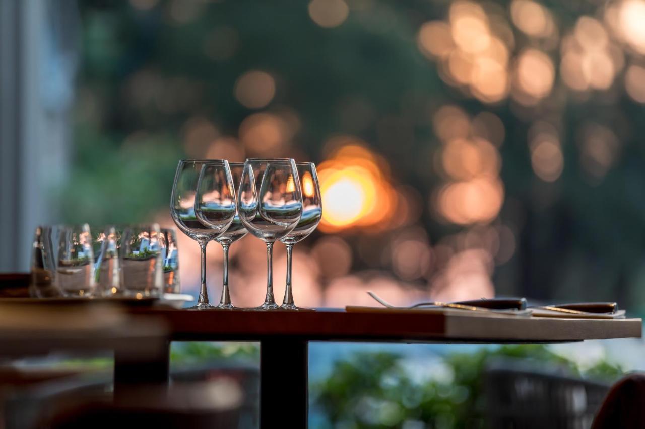Outrigger Surin Beach Resort - Sha Extra Plus Exterior photo Wine glasses