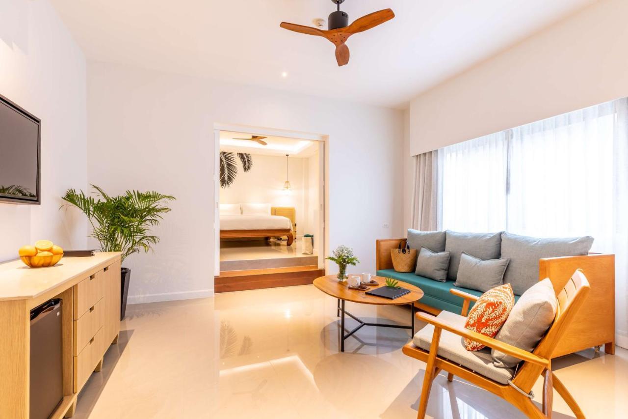 Outrigger Surin Beach Resort - Sha Extra Plus Exterior photo A living room in a serviced apartment in Singapore